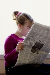 girl-reading-paper