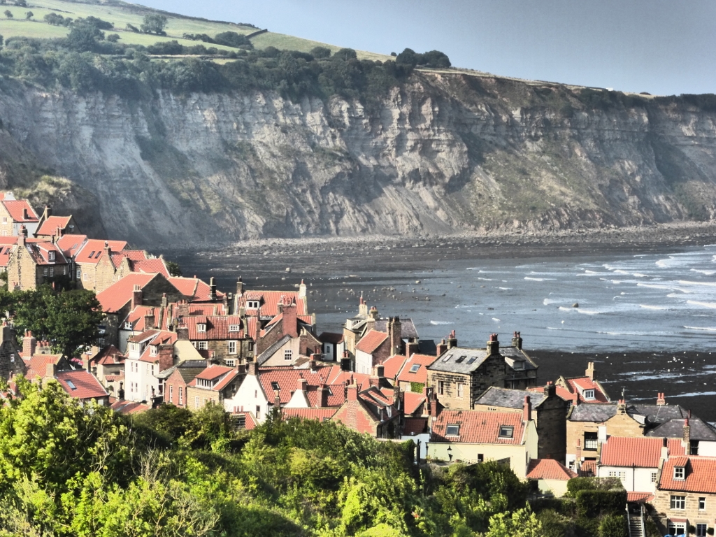 Robin Hood's Bay fishing village with a cliff across the bay.