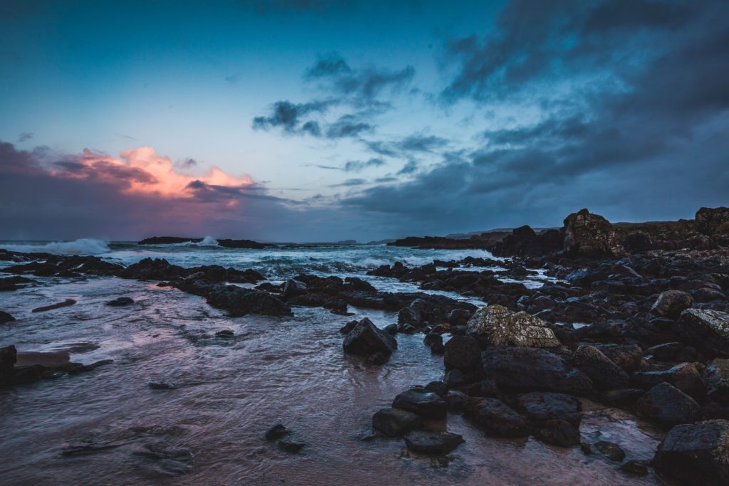 sunrise over a rocky seashore